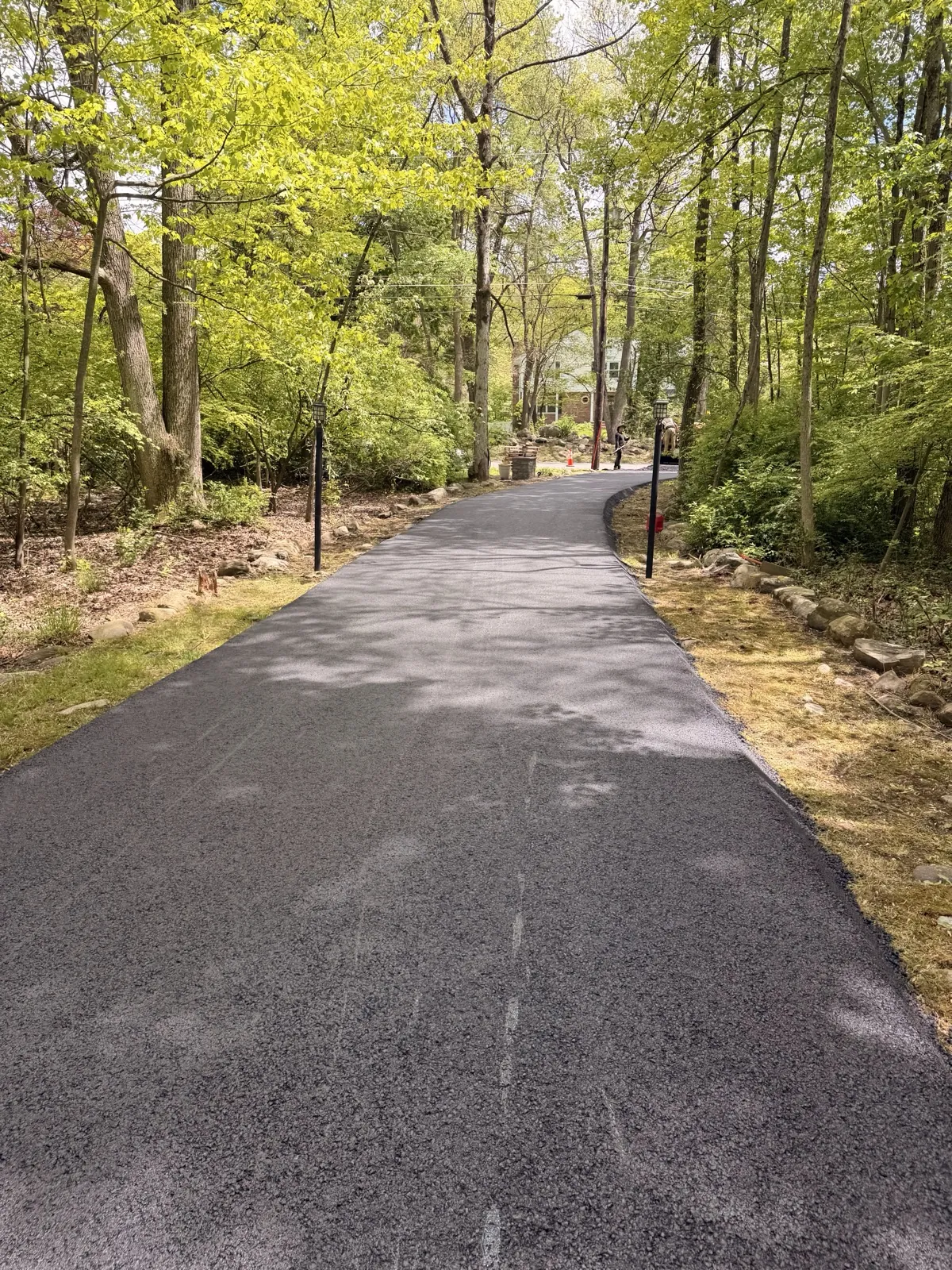 Wooded estate driveway paved by All County across northwest NJ